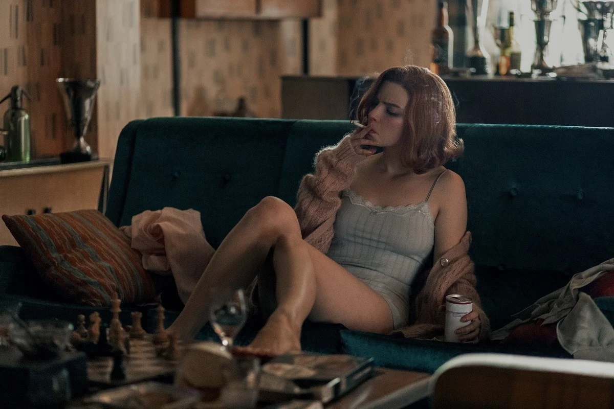 Actress Anya Taylor-Joy from the Queen's Gambit scene where she's smoking and drinking. 